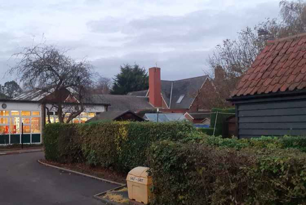 St Nicholas C of E School: leylandii are clearly visible to the rear of the building