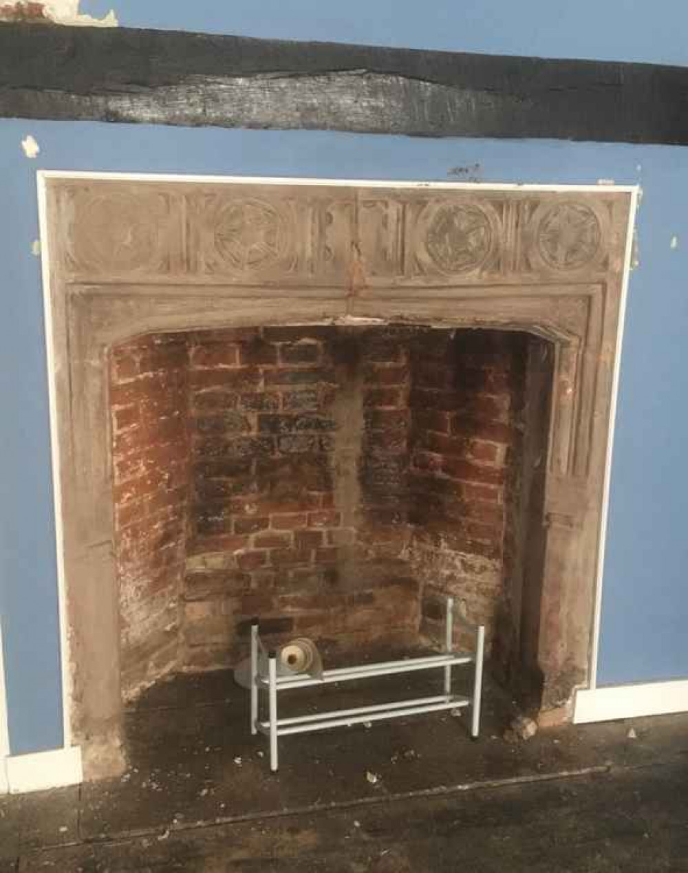 The Tudor fireplace in a first floor room