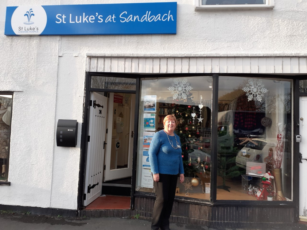 Volunteer, Pat Arnold, outside St Luke's Hospice shop in Sandbach.   