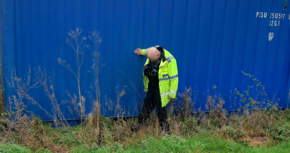 Police officer doing a sweep for knives in Shepton Mallet