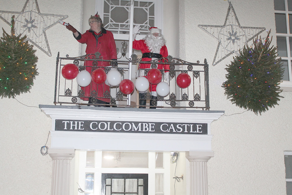 Father Christmas switched on Colyton's festive illuminations with a countdown from the balcony of The Colcombe Castle