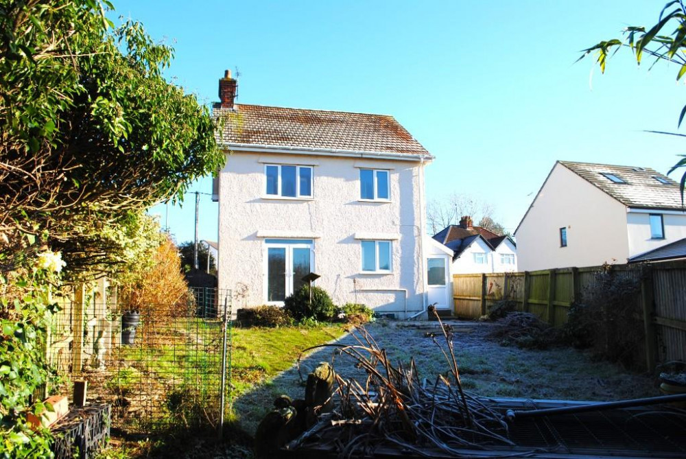 The house has a large enclosed garden