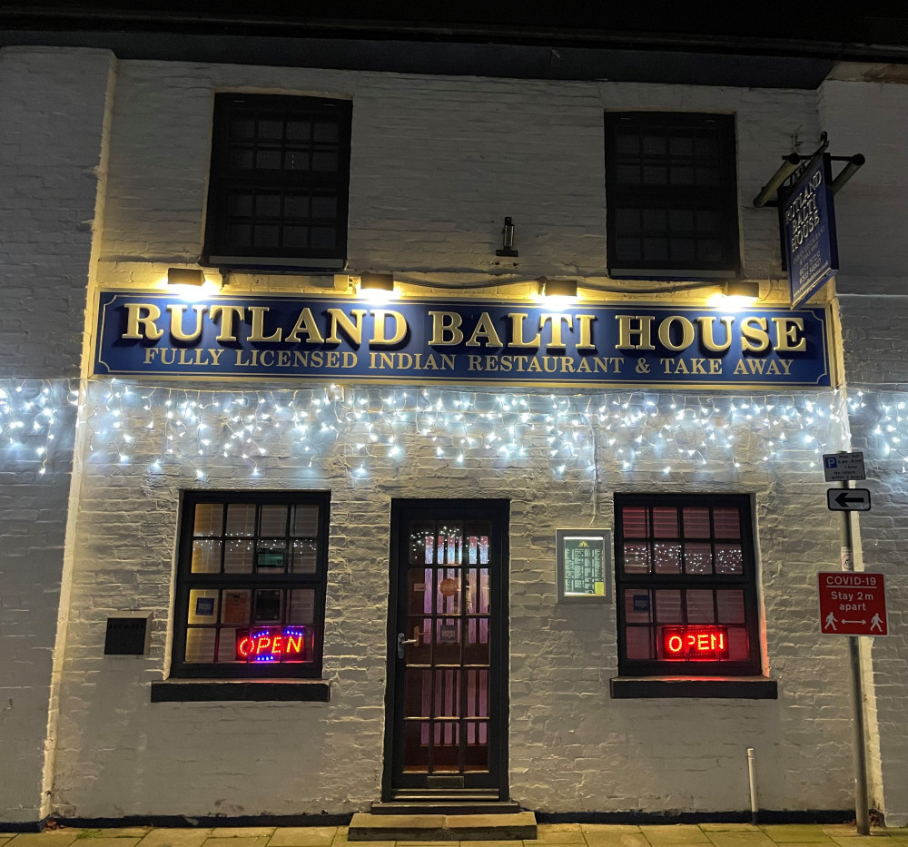 Rutland Balti House illuminated on Mill Street, Oakham. 