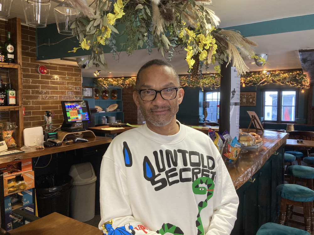 Ray Ribeiro at the bar inside The Globe Inn, Lympstone (Nub News/ Will Goddard)