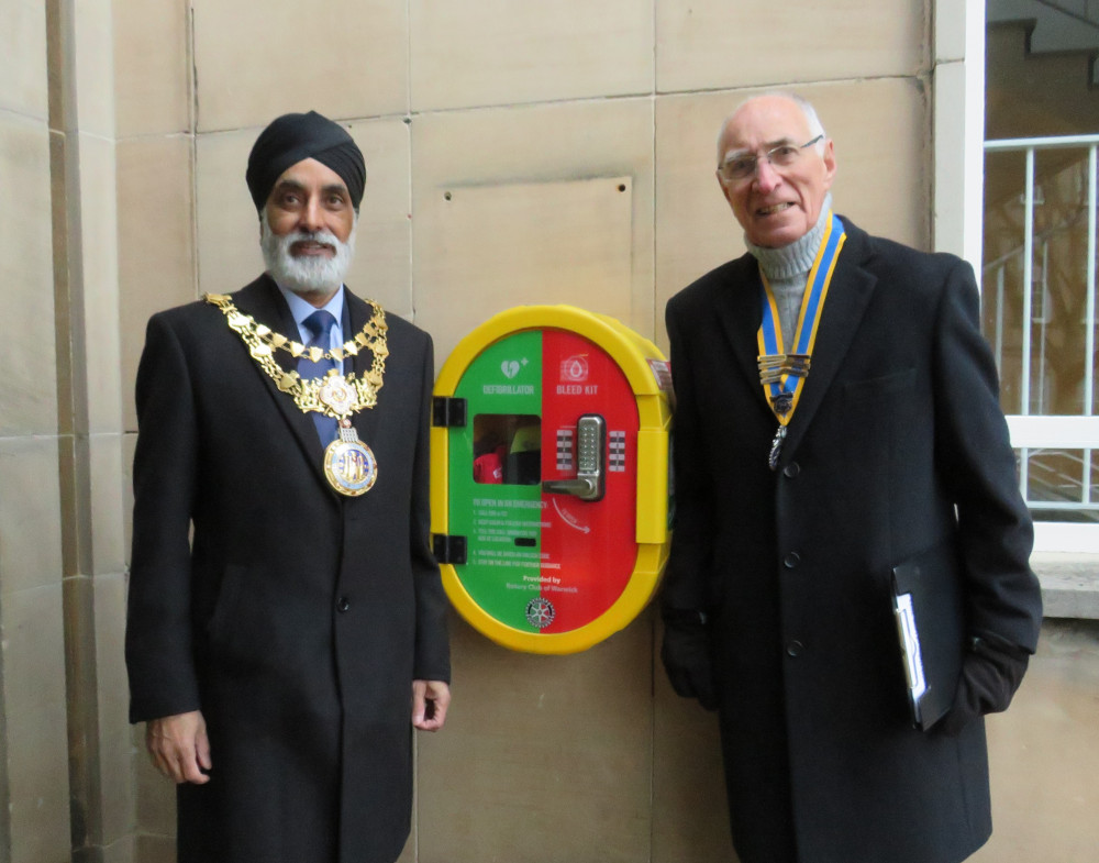 Mayor or Warwick Cllr Parminder Birdi and Rotary Club President Keith Talbot at the new two-tone door