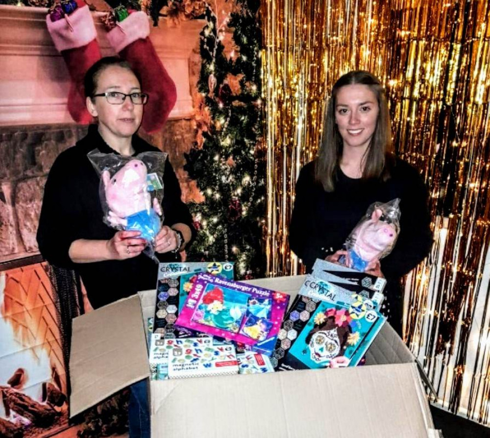 Head of Children and Families at the Wishing Well, Mabyn Meredith, receiving donations from Swansway representative, Philipa Wynne (Crewe Nub News). 