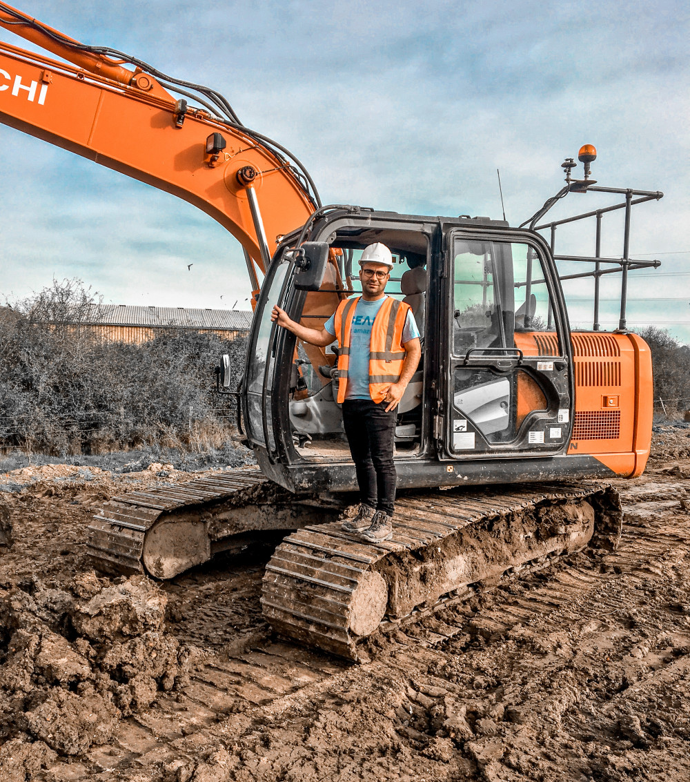 Javad, another young person helped by Beam, working as a digger operator