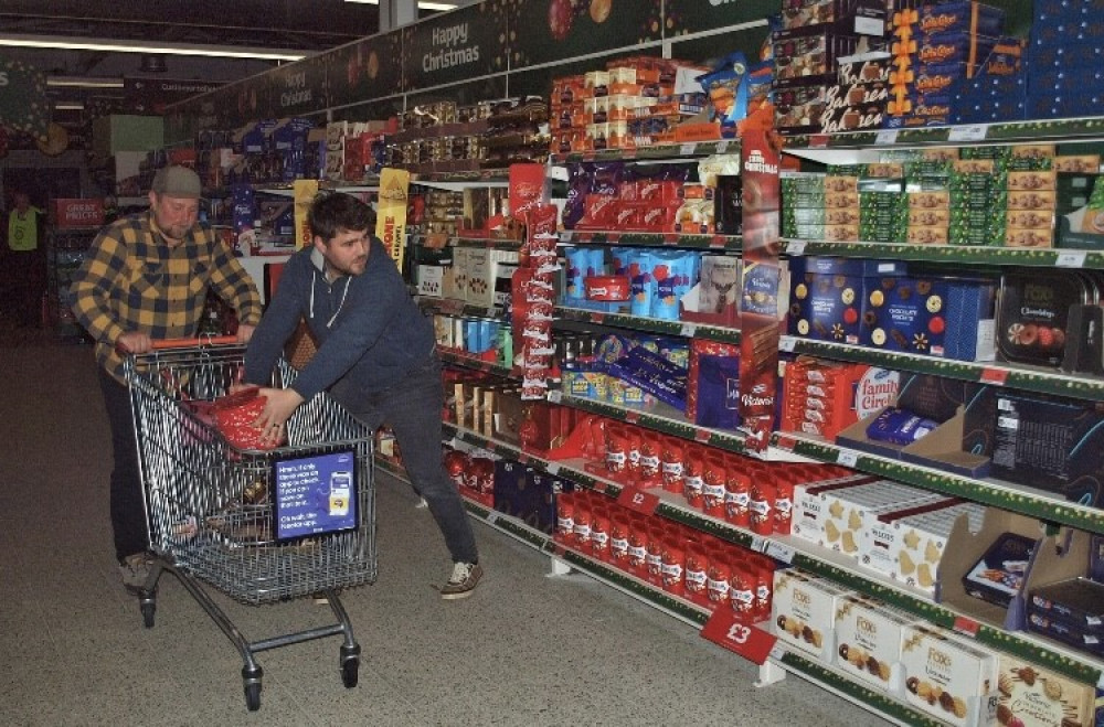 Dan (left) and Josh get as many goodies as they can. (Image: Helston Rotary Club) 