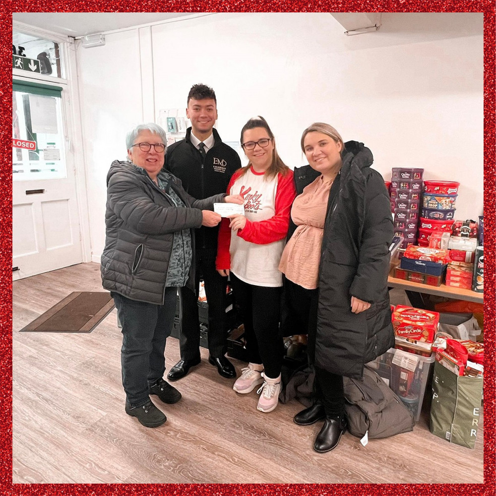 Rutland Musical Theatre members at Rutland Foodbank with their donations.