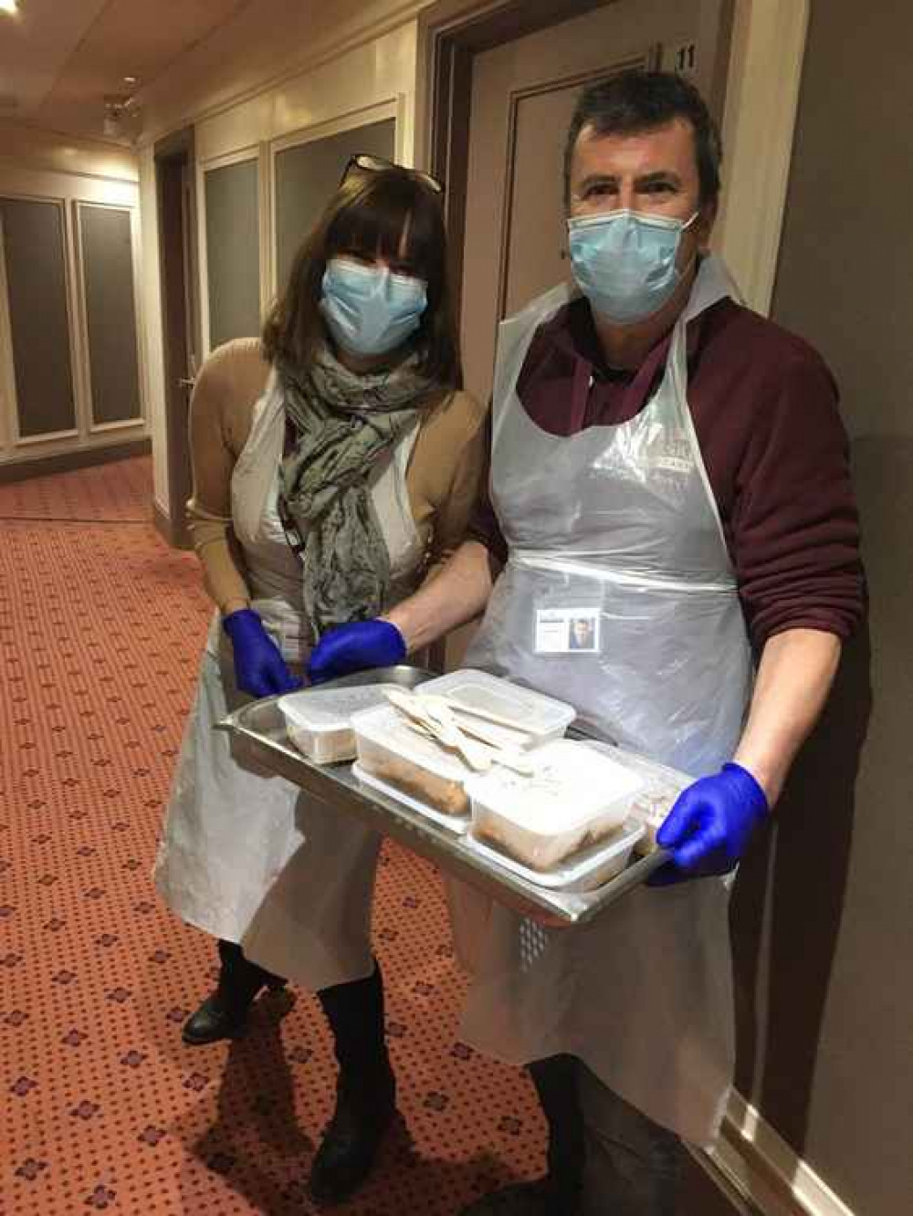 Kerry Dunn and Gil Martin, Home Instead caregivers, bring food to evacuated residents Kerry Dunn and Gil Martin, Home Instead caregivers, bring food to evacuated residents