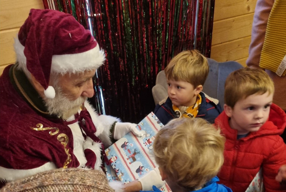George giving out Christmas gifts (Doveleigh Care) George giving out Christmas gifts (Doveleigh Care)