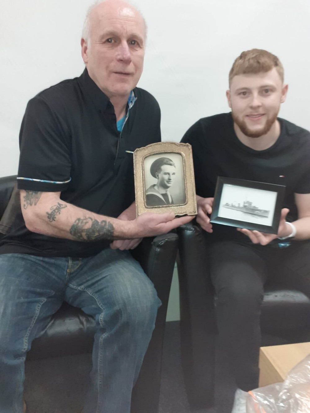 David Adderley (left) holds the photograph of his late uncle, Norman Tudor, who died when the ship sank while David's son William, holds a family photo of HMS Vimiera. 