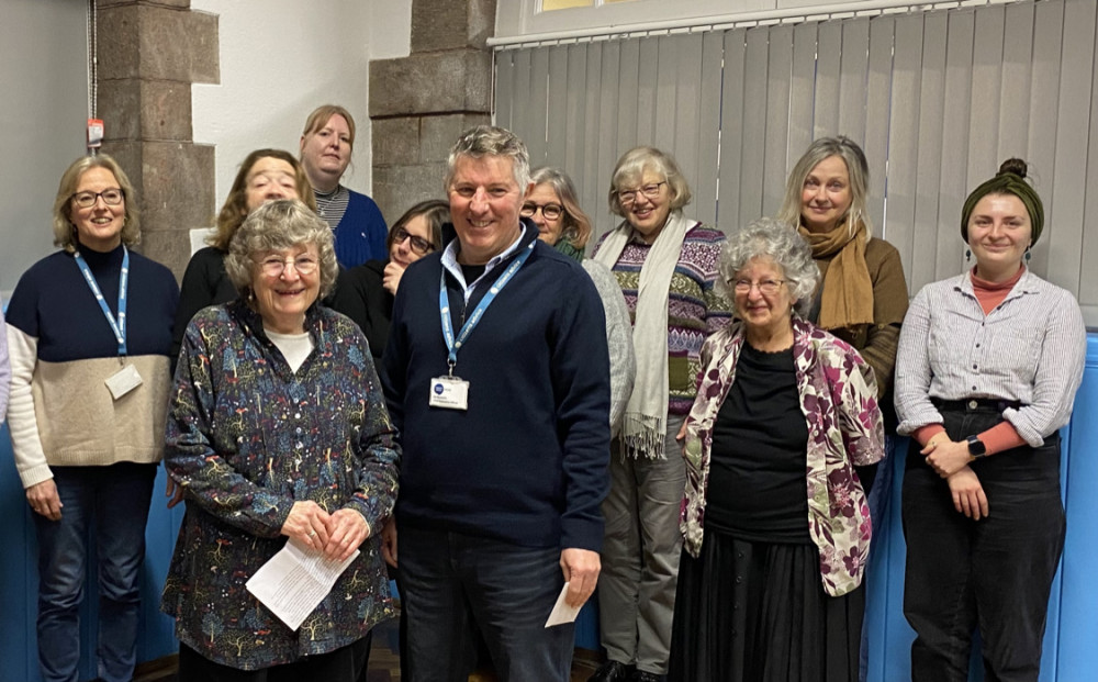 Alison Cholmondeley (left foreground) with Ian Byworth (right) CEO of Citizens Advice Mendip, together with friends and colleagues. 