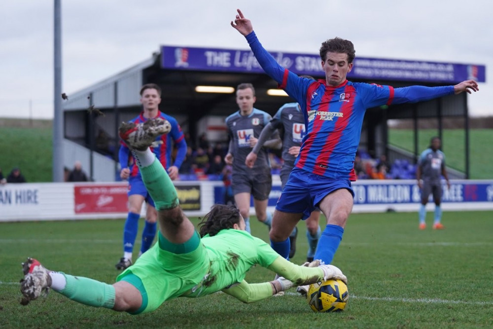 Danny Sambridge denies Harry Phillips a rebound after saving his penalty. 