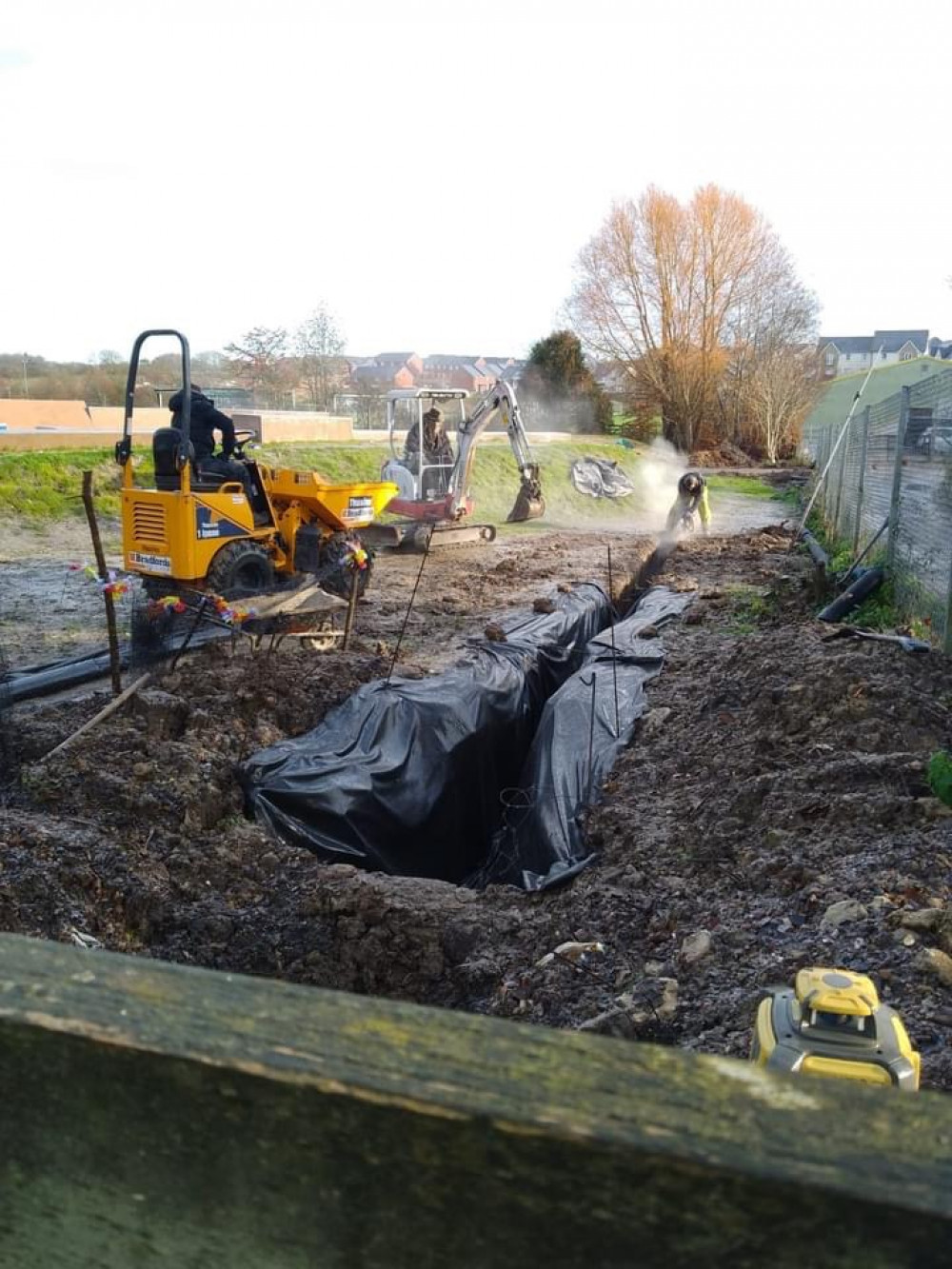 The skatepark team carry out the drainage work 