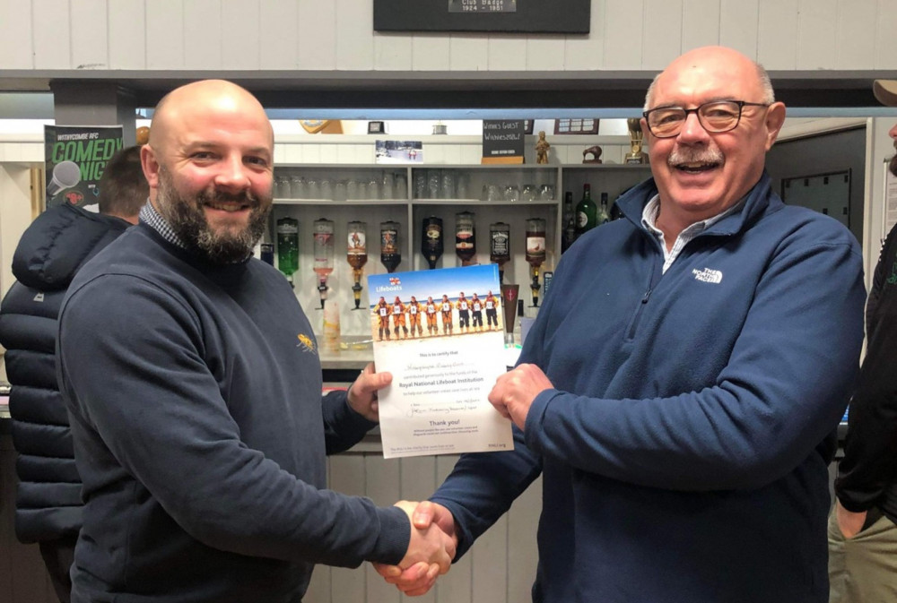 RNLI Crew Member and Withycombe Coach Jason Luff presents certificate to Withycombe Chairman Merv Richards (Exmouth Withycombe RFC)