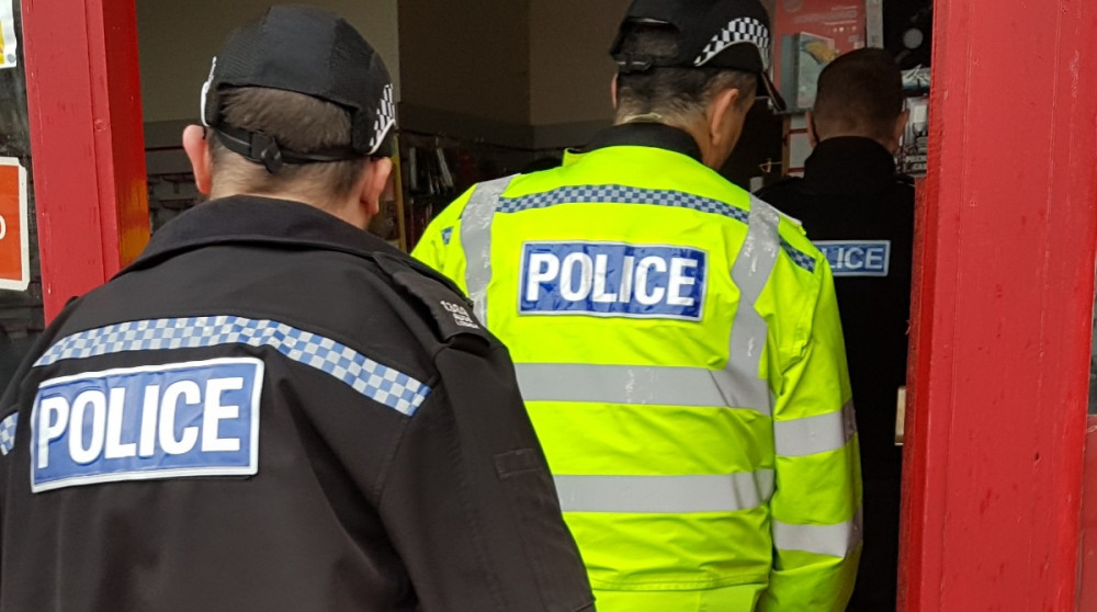 Police entering the property in Hotel Street, Coalville. Photos: North West Leicestershire Police