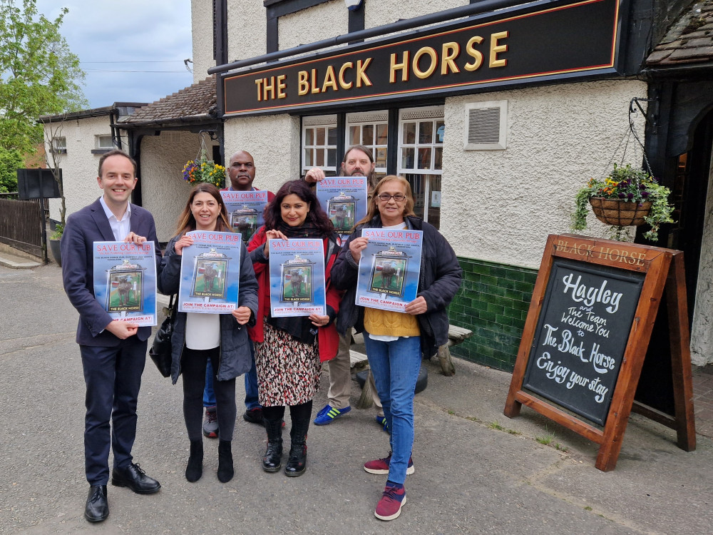 James Murray MP and the Protect the Black Horse group outside the pub in April 2022