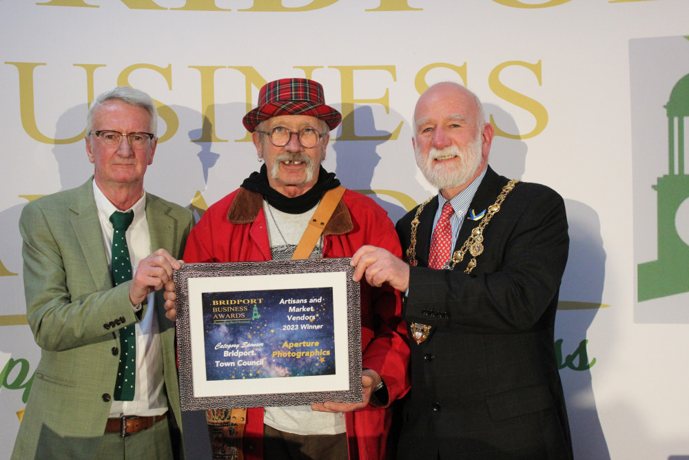 Doug Chalk of Aperture Photographics collects the award for Arts & Crafts Business of the Year