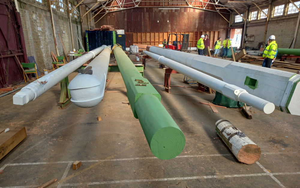 mast being restored below sparrow hawk at Nelson Hall