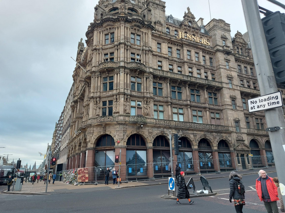 The former department store, now surrounded by floral tributes to the dead fire officer