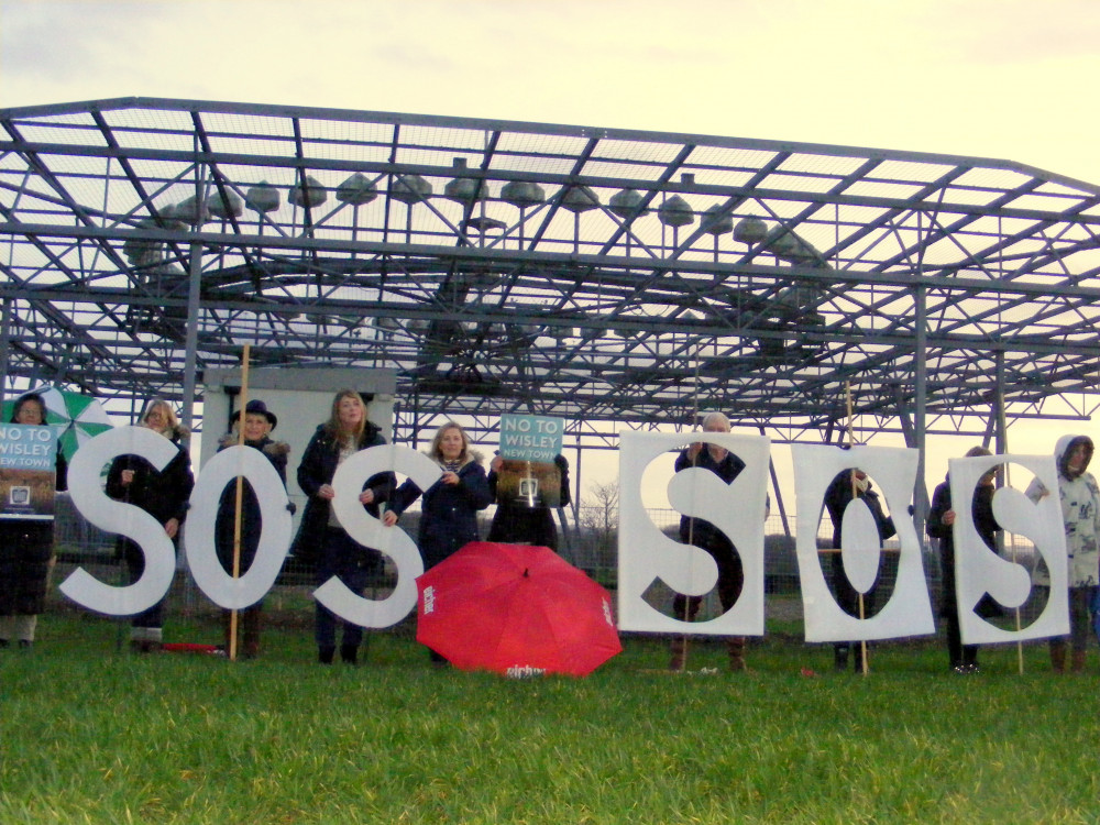 WAG campaigners at the Ockham Beacon to highlight the risk to aircraft safety from the planned Taylor Wimpey development