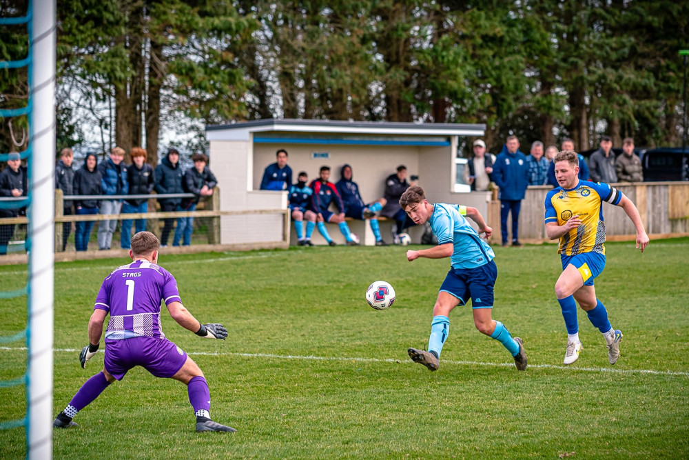 Beer Albion's Taylor Rooke scoring the Fisherman's goal. Photo by Pitchside Photography