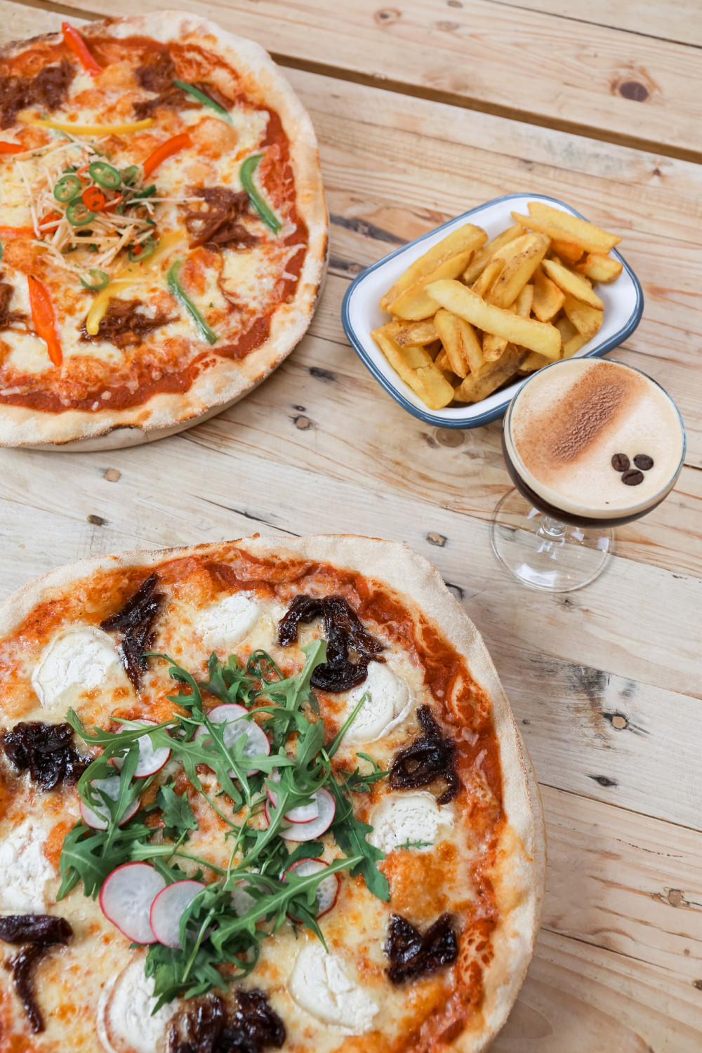 Indulge in pizza and cocktails at The Watch House Cafe in West Bay (photo credit: The Hive Beach Co)