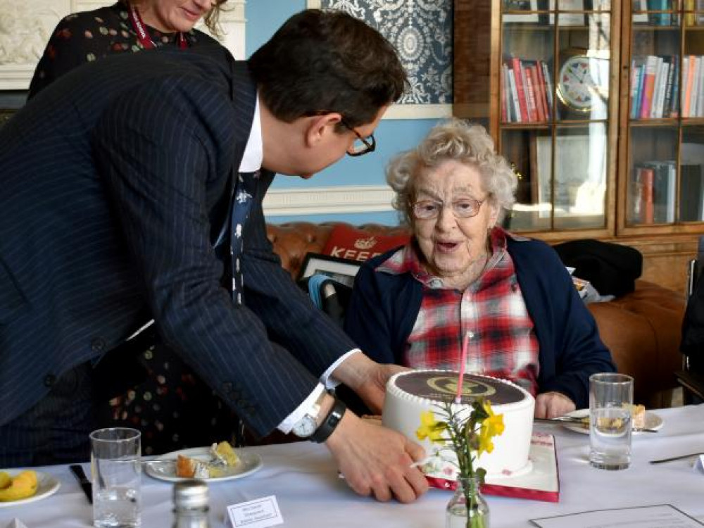 108-year-old Joan Kersey receives cake from head teacher Dan Browning (Picture: Ipswich High School) 108-year-old Joan Kersey receives cake from head teacher Dan Browning (Picture: Ipswich High School)