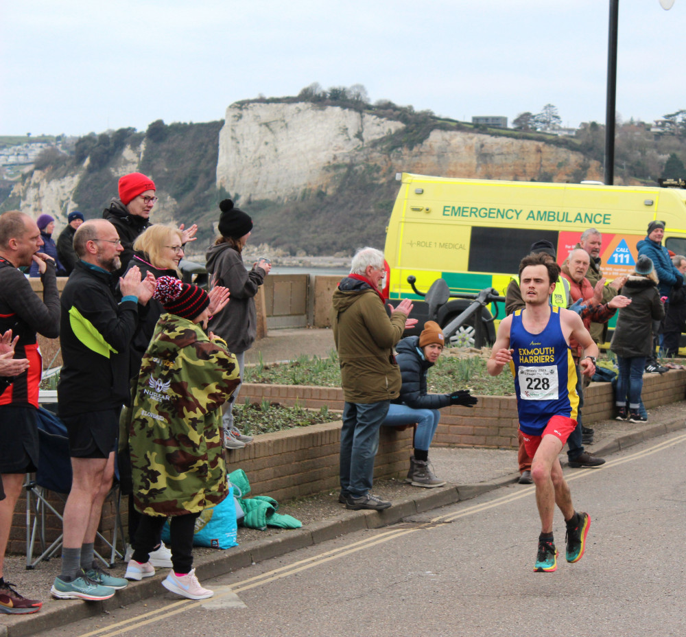 Sam Kelly of Exmouth Harriers reaches the finish line of the 20-mile Grizzly