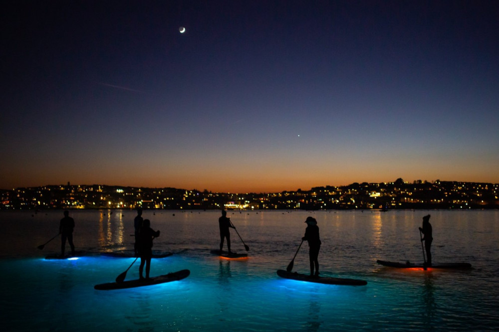 Take a night time tour around Flushing and Falmouth (Image: Night Paddleboard Tours Cornwall)