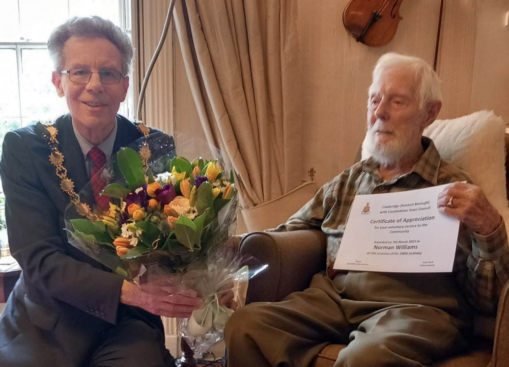 Mayor Cllr John Andrew presents a certificate of recognition to Norman. Mayor Cllr John Andrew presents a certificate of recognition to Norman.