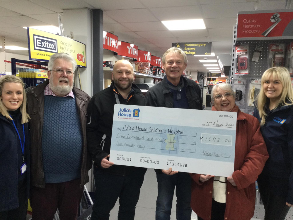 Bradpole residents Monica and Rob Teague with TV star Martin Clunes and representatives of Bridport Building Supplies and Julia's House children's hospice