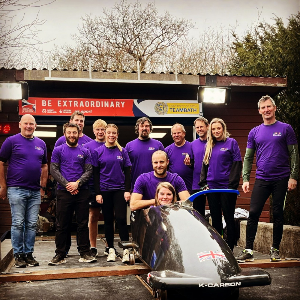 Woodroffe School headteacher Dan Watts (centre) and other fundraisers at the British Bobsleigh Launch Centre at Bath University