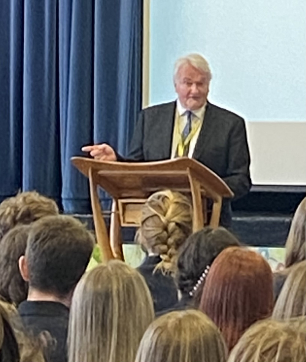 Lord Burnett addresses students at Plume Academy today. 