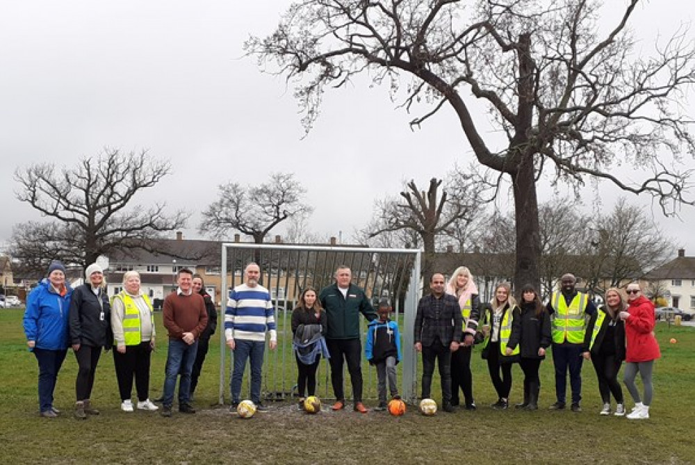 Members of the community join council teams, representatives from Mears and Huws Gray, Cllr Qaisar Abbas, Cllr Andrew Jefferies, and Cllr Paul Arnold on Saturday 18 March to celebrate the installation of new goalposts at Bonnygate Park