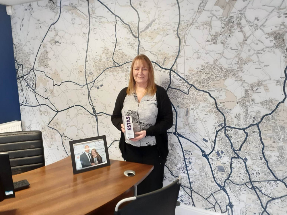 Sales manager, Margret with her ESTA award and the photo of her receiving it from TV personality, Phil Spencer.  