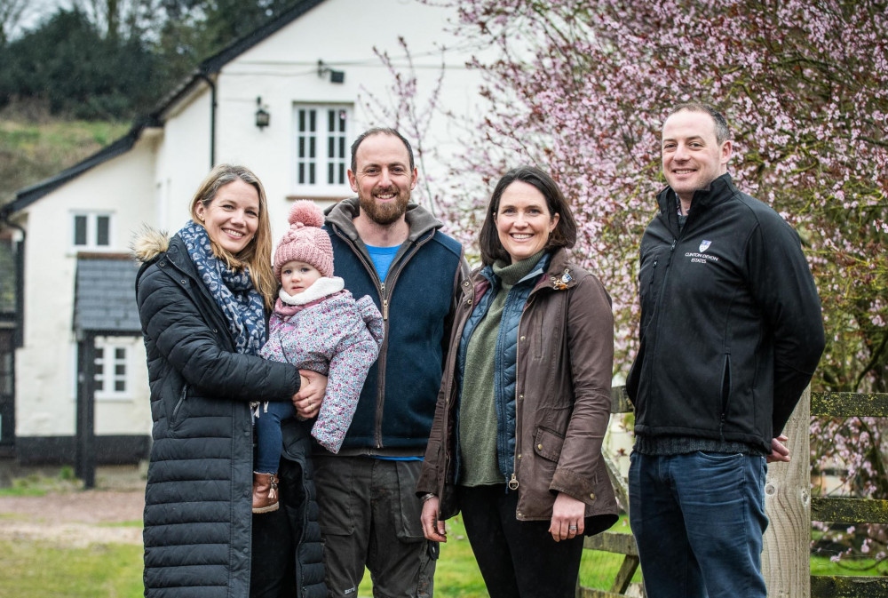 Ollie White, centre, and partner Charlotte holding daughter Poppy, left, with Clare James, right, and Sam Briant-Evans (Clinton Devon Estates)