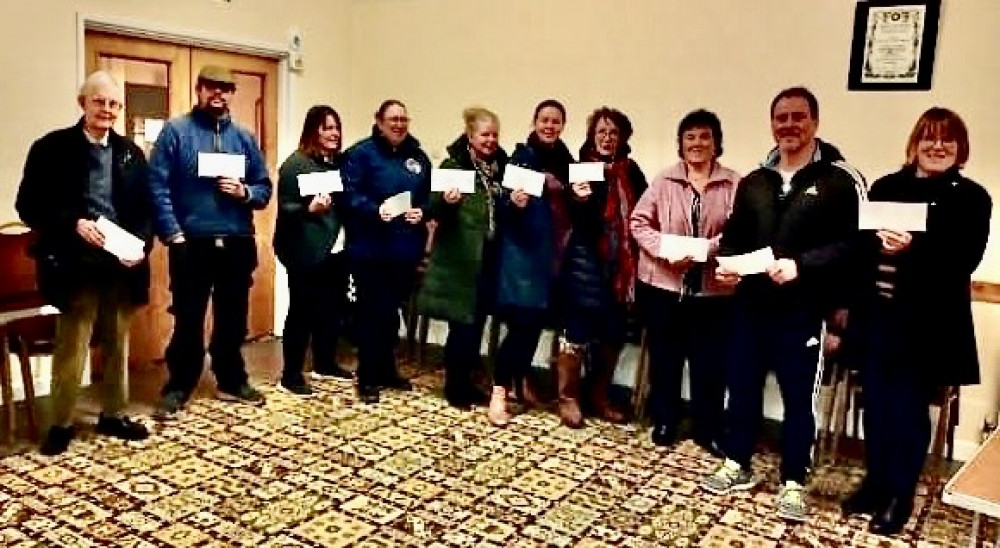 Representatives of local organisations collect their cheques at a recent meeting of Colyton Carnival Committee