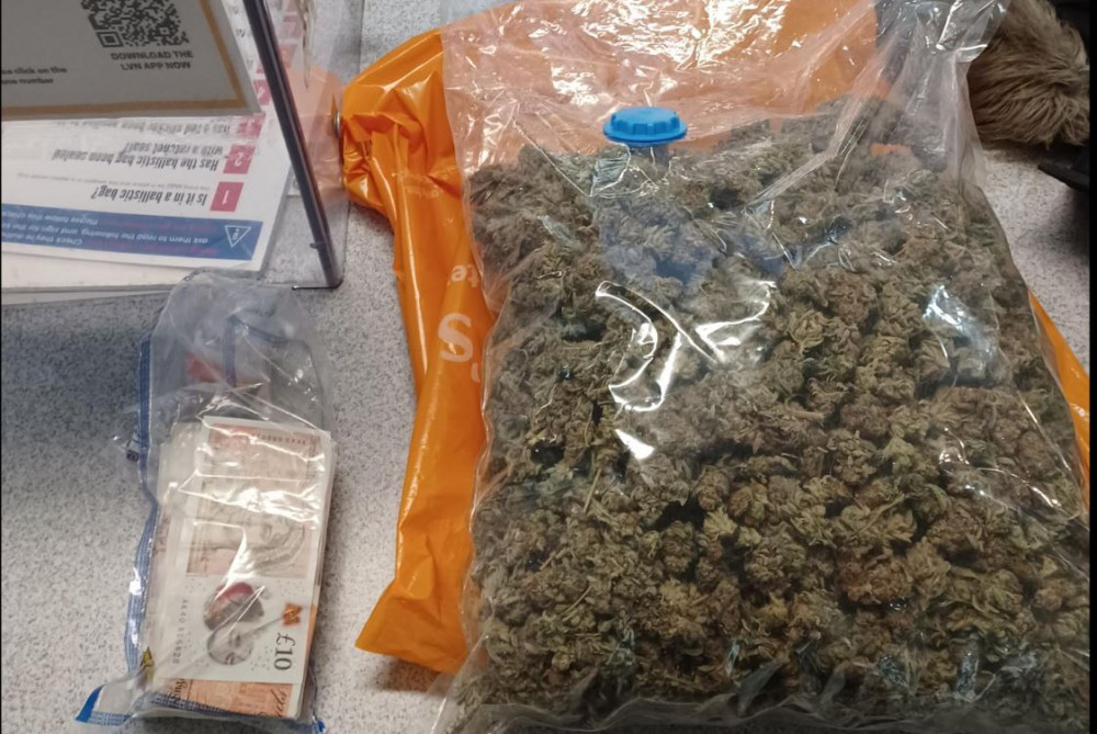 A drug dealer has been arrested after a large amount of cash and cannabis were found hidden in a tumble dryer at an address in Barnes. Credit: Metropolitan Police.