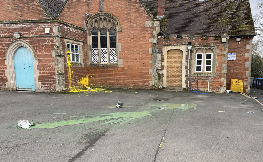 Masonry paint has been thrown over the walls and play area at Cubbington C of E Primary School (image via Kenilworth and Warwick Rural Police)