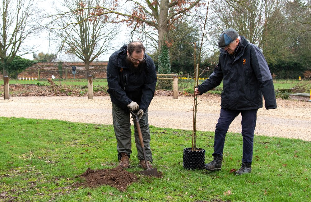 Adam and David planting trees (image by Jana Eastwood)