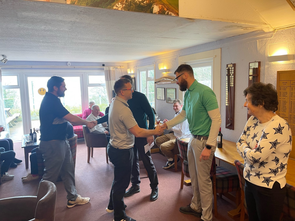 the overall winners of the Drive-In being congratulated by the three captains