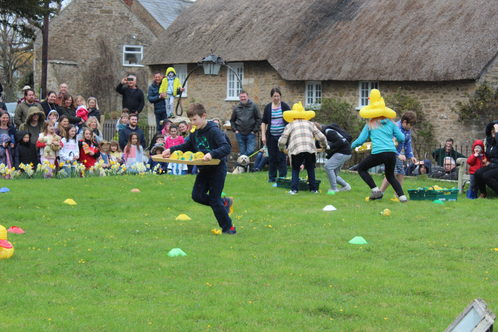 Children dressed as ducks and raced on dry land in Burton Bradstock on Saturday, due to the poor forecast