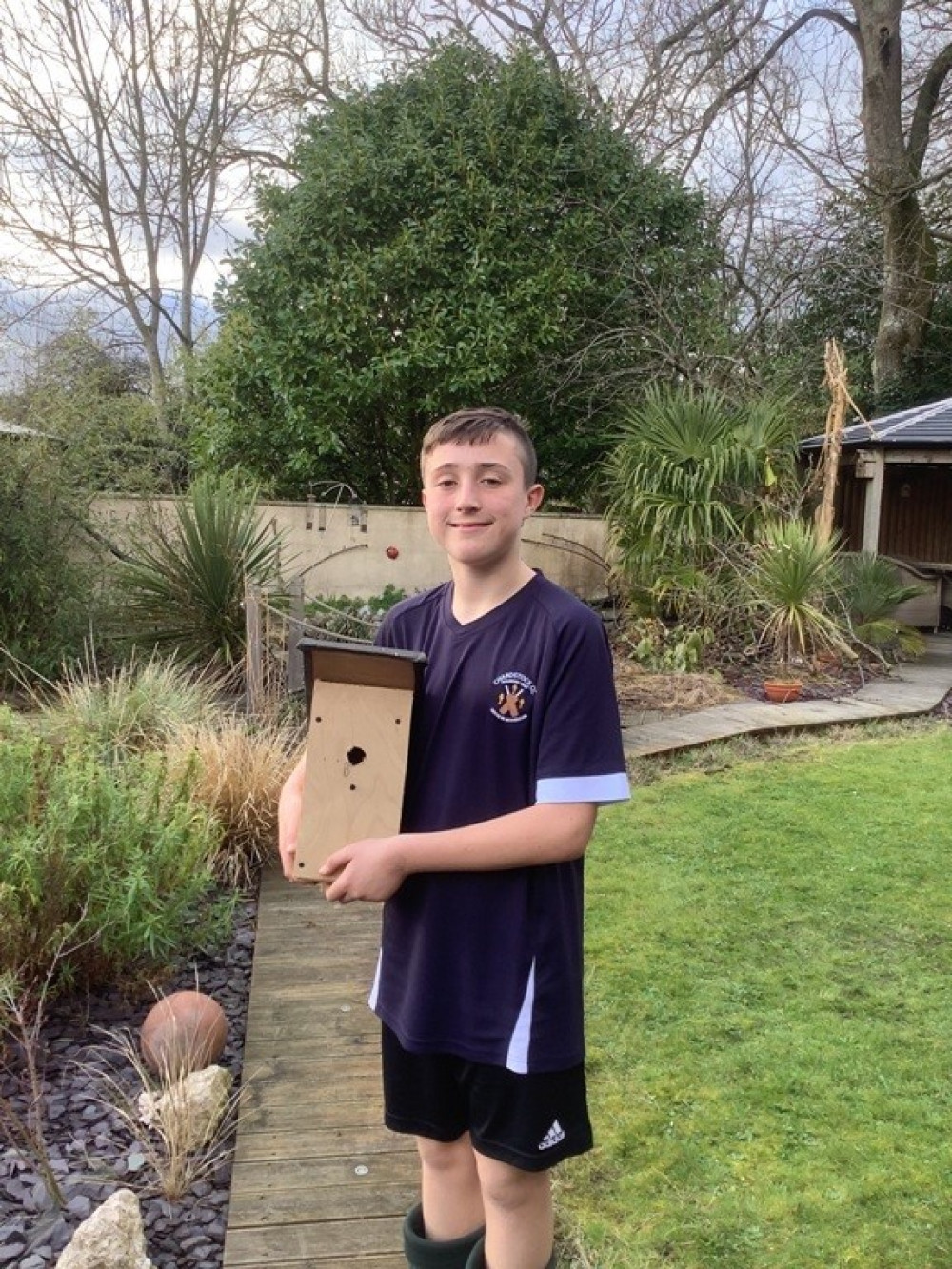 Chardstock resident Archie Garth, aged 14, with one of his bird boxes