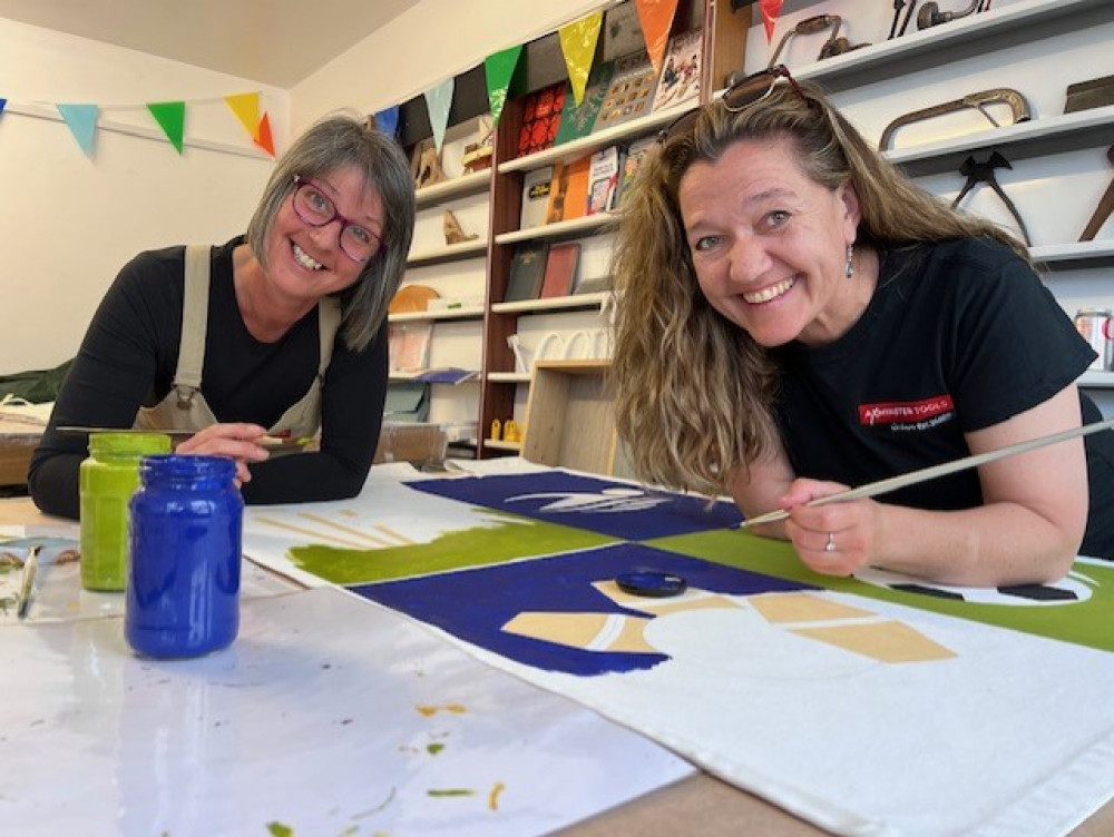 Volunteers working on the colourful Axminster banners