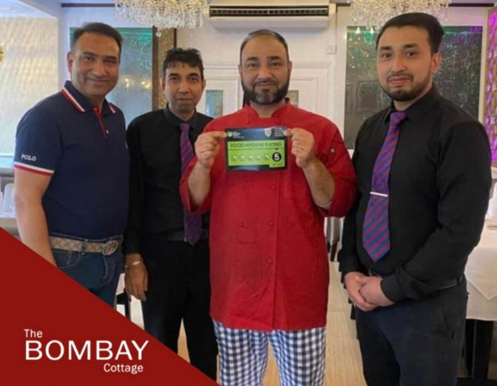 The team celebrating their 5 star rating. Image credit: Bombay Cottage. 