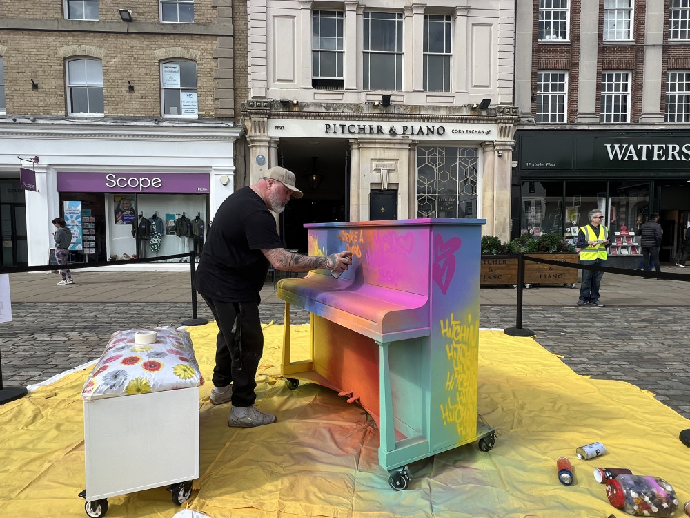 The new Hitchin Piano decorated by Mark Meana is a project supported by community interest company Hitchin Creative and managed by the Hitchin BID team. CREDIT: @laythy29