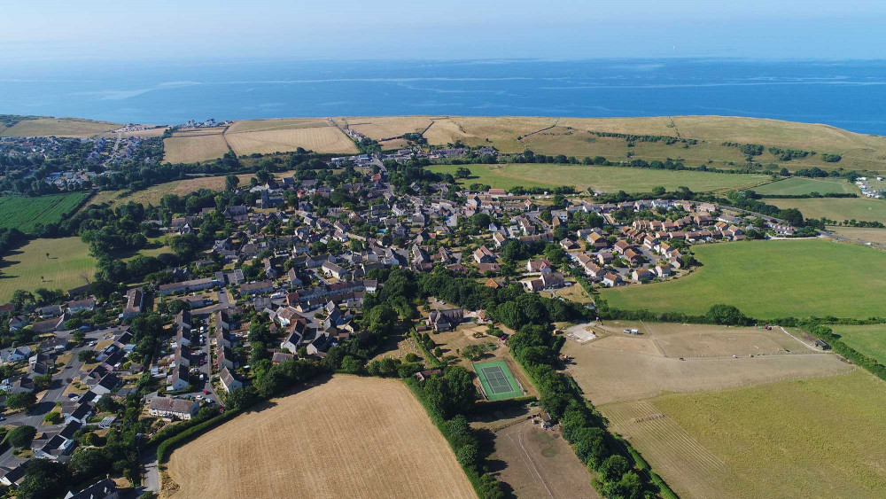 What is the identity of Burton Bradstock (photo credit: Burton Bradstock Community Land Trust)