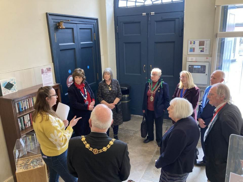 Shire Hall Museum's Tamsin Little shows the civic guests around the attraction (photo credit: Discover Dorchester/Dorchester Town Council)